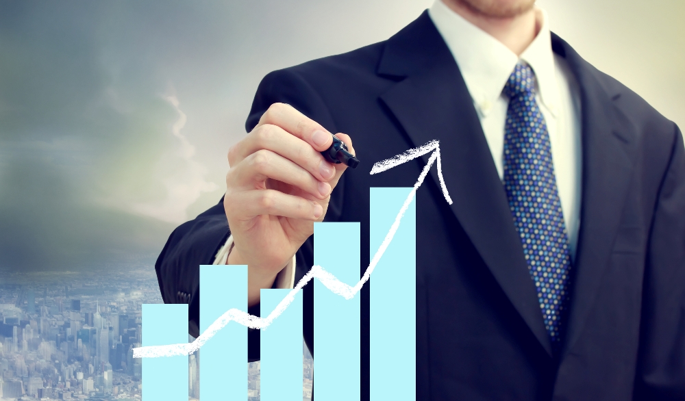business man with chart showing growth